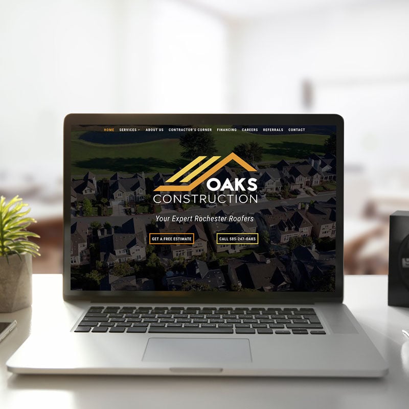 Laptop displaying South Oaks Financial Center website on a desk.